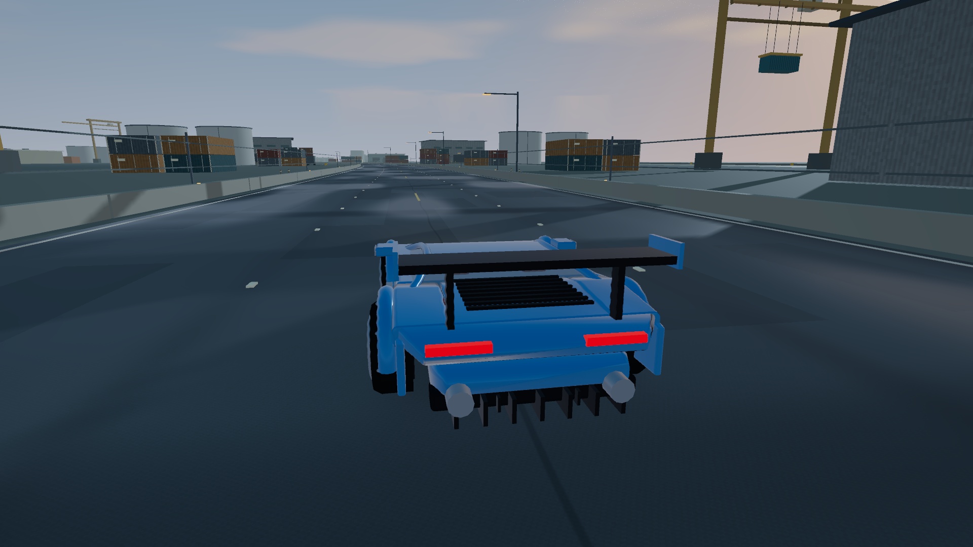 A blue Spectre with fitted modifications driving through Port Meridian